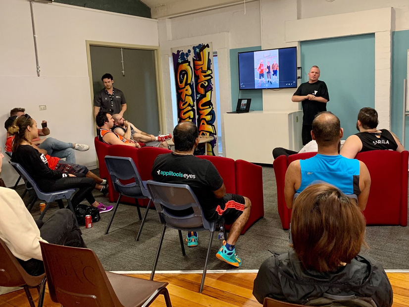 A presentation is being given at the Y Streetball four year celebration.